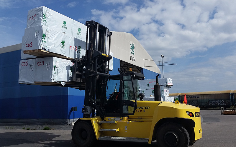 Warehouse managers monitoring forklift operations in a Singapore logistics facility